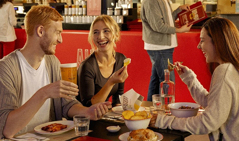 Group of friends enjoying a testing inside an ALT restaurant